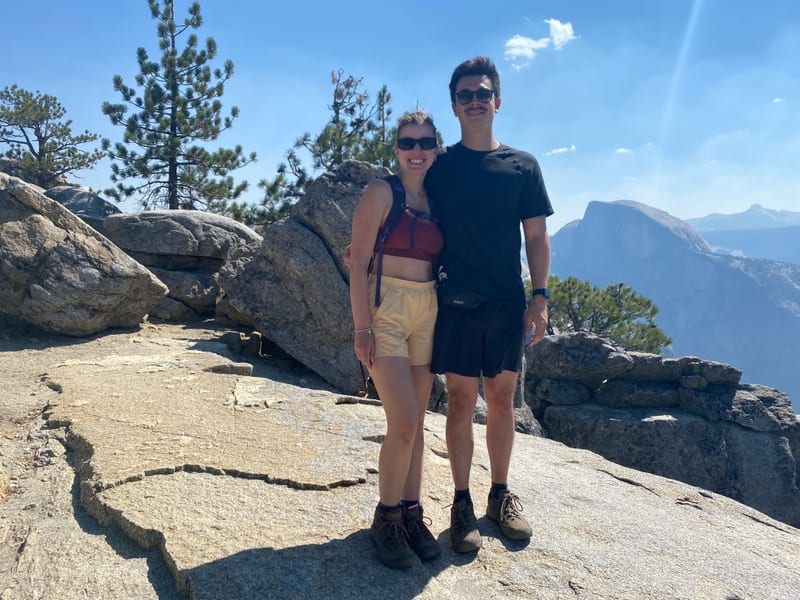 Scott and his partner at Glacier Point in Yosemite, Half Dome behind them