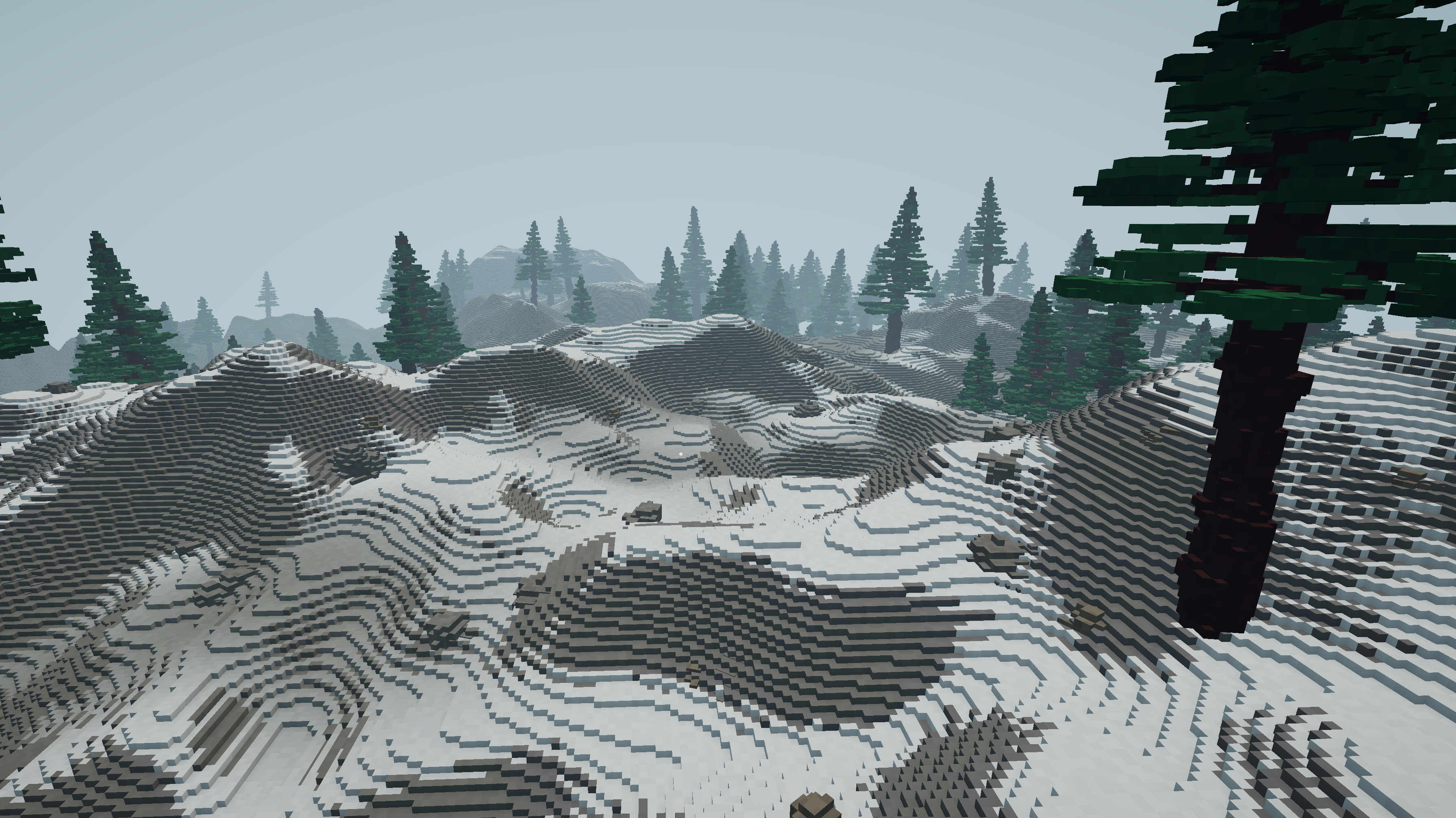 An alpine vista of stepped snow-covered voxel terrain with pines fading into fog